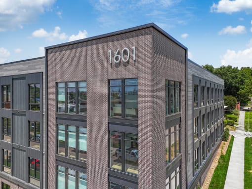 the side of a brick building with the number 1001 on it
