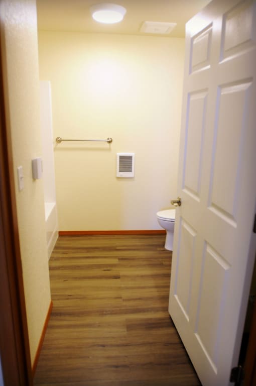 Image of bathtub, towel rack, and toilet
