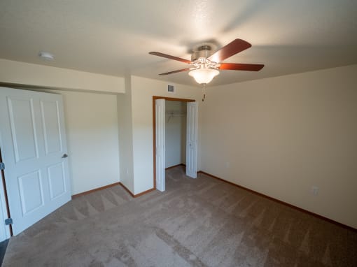 Image of bedroom and closet with hanger rack