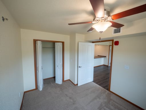 Image of bedroom and closet with hanger rack