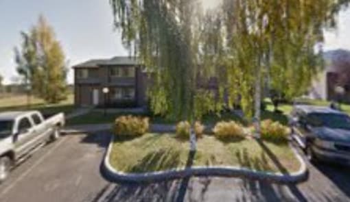 Image of Sunnyside 2 Apartments showing off street parking.