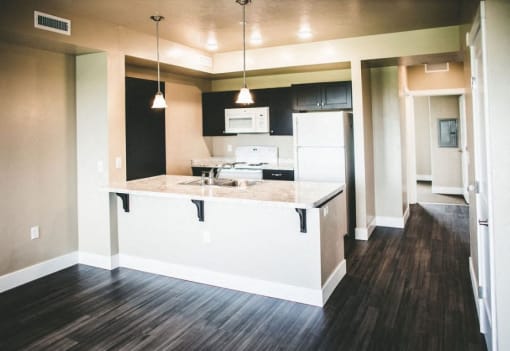 a view of a kitchen and a living room from above