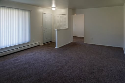 Living room and Entrance at Huntington Club Apartments in Warren, Michigan