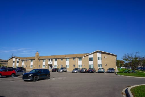 Parking lot with ample parking spaces, at Huntington Club Apartments in Warren, Michigan