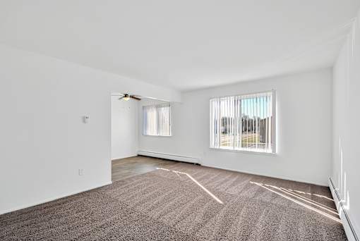 Spacious apartment living room at Huntington Club Apartments in Warren, Michigan