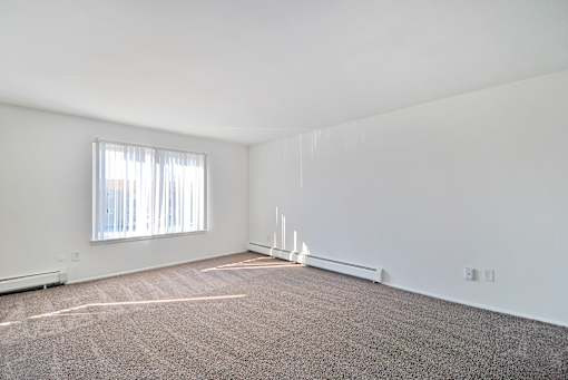 Spacious apartment living room at Huntington Club Apartments in Warren, Michigan