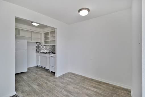 Modern one-bedroom apartment kitchen and dining room at Silverstone Apartments in Warren, MI