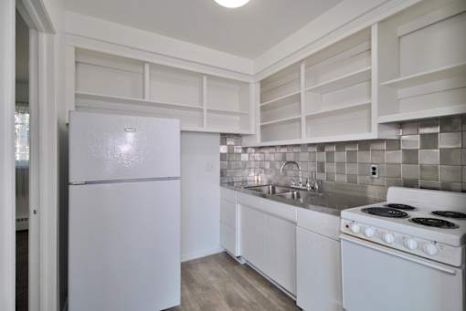 Apartment Kitchen with bright cabinets and ample storage in Warren, MI