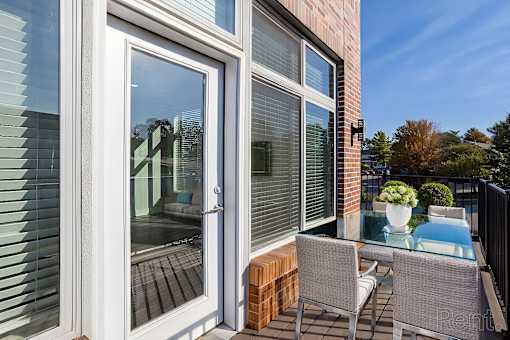 A patio with a table and chairs is shown.
