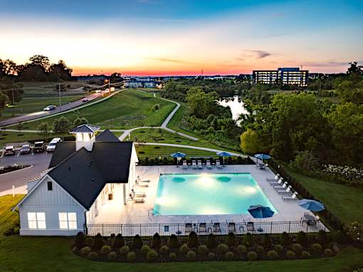 A large house with a pool in the backyard.