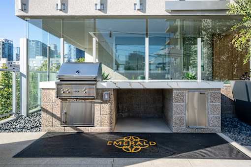 A modern house with an outdoor kitchen area.
