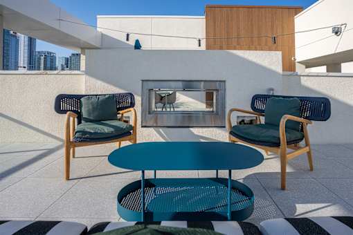 A patio with a table and two chairs.