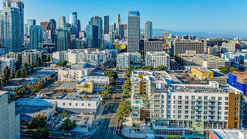 A cityscape with a mix of modern and older buildings.