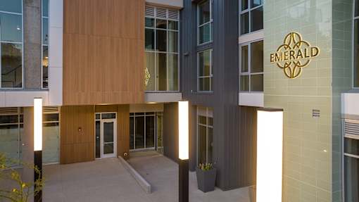 The front of a building with a sign that says Emerald.