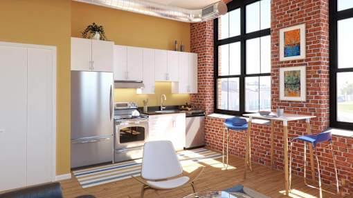A kitchen with a refrigerator, oven, and bar stools.