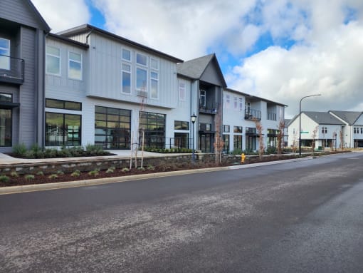 a row of new town houses on the side of a street