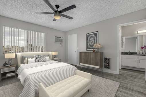 a bedroom with a large bed and a ceiling fan