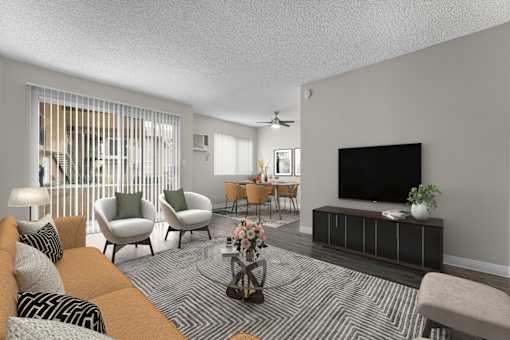a living room with a couch and chairs and a tv
