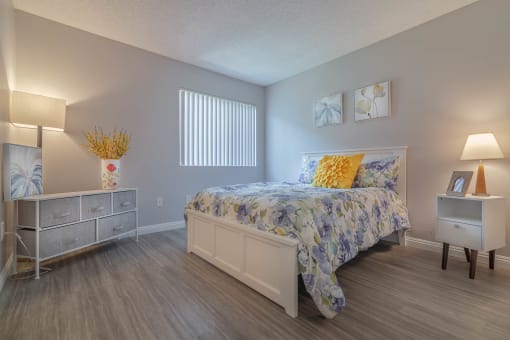 a bedroom with a bed and a dresser