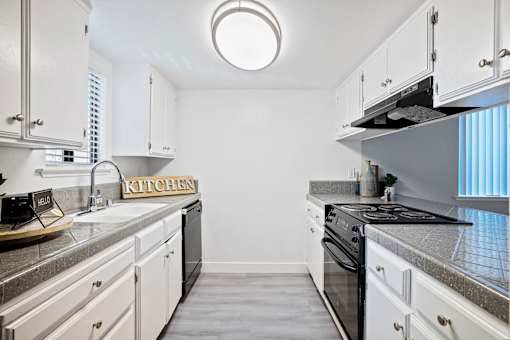 A kitchen with a sign that says