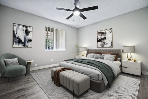 a bedroom with a large bed and a ceiling fan