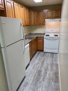 a laundry room with a washer and dryer in a kitchen