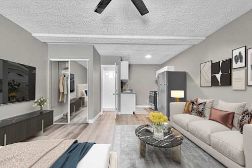 A modern living room with a white couch and a coffee table.