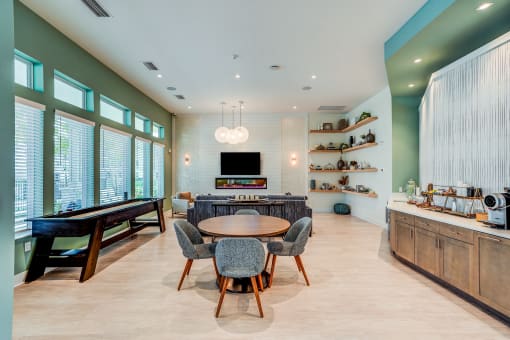 a dining room with a table and chairs and a pool table