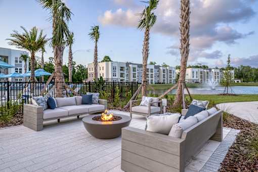 Firepit surrounded by resident and guest seating area.