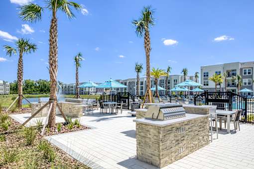 Poolside BBQ and seating area for residents and guests.