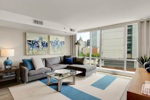 Open living area with floor to ceiling windows at The Zenith, Baltimore