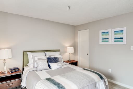 a bedroom with a bed and two night stands at Hamilton at Kings Place, Columbia, 21046