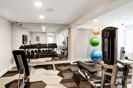 a spacious fitness room with weights and other exercise equipment at Hamilton at Kings Place, Columbia, MD 21046