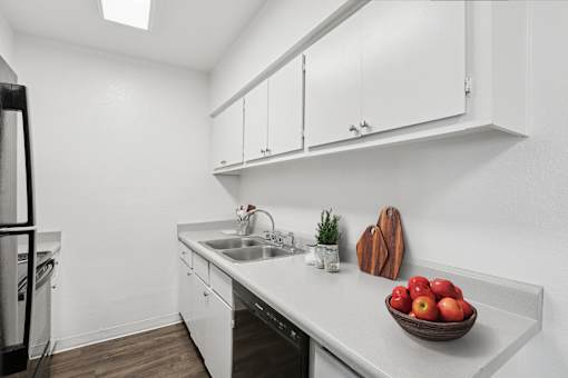 A kitchen with a bowl of apples on the counter at Riviera Park, Chandler Arizona