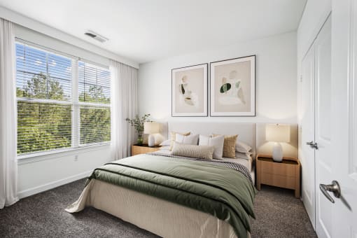 a bedroom with a bed and a large window at Aspire Apollo, Camp Springs, MD