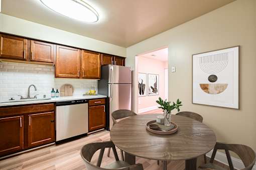 Kitchen with dining area at Poplar Glen Apartments, Maryland.