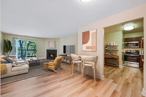 A living room with a fireplace at Poplar Glen Apartments, Maryland, 21044.