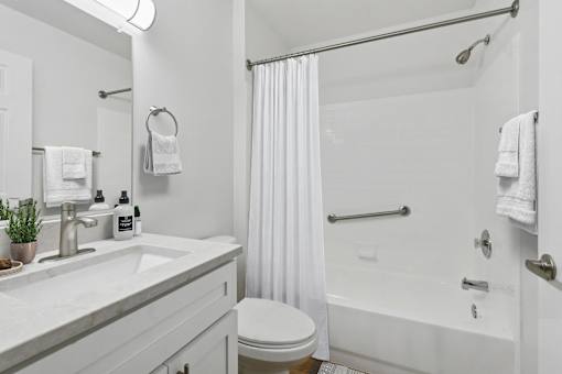 Bathroom with tub shower combo and vanity at Park at Winterset Apartments, Owings Mills, MD