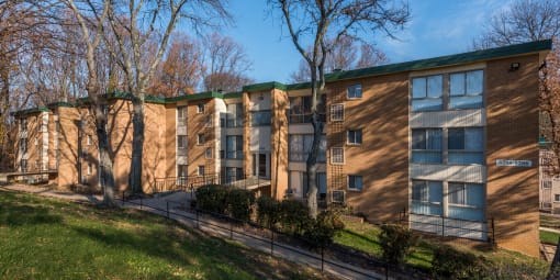 Building with a green roof and a sidewalk in front at Meadows at Capitol Heights, Capitol Heights, 20743