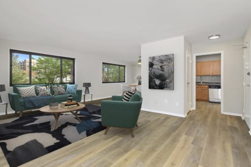 a living room with a couch and a chair at Earle Manor Apartments, Wheaton, Maryland