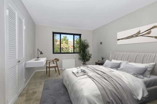 a bedroom with a bed and a desk and a window at Earle Manor Apartments, Maryland