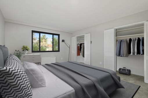 a bedroom with a bed and a closet at Earle Manor Apartments, Wheaton