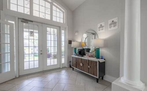A white room with a wooden cabinet and a white pillar at Ellicott Grove, Ellicott City, MD 21043