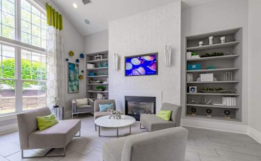 A living room with a fireplace, a television, and a couch at Ellicott Grove, Ellicott City, MD 21043