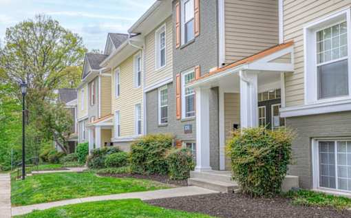 A row of houses with green lawns in front at Ellicott Grove, Ellicott City, MD 21043