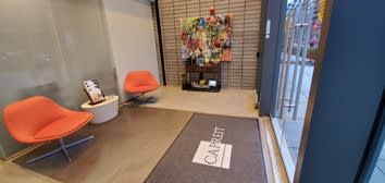 A waiting area with chairs and a sign that says "CABIN".