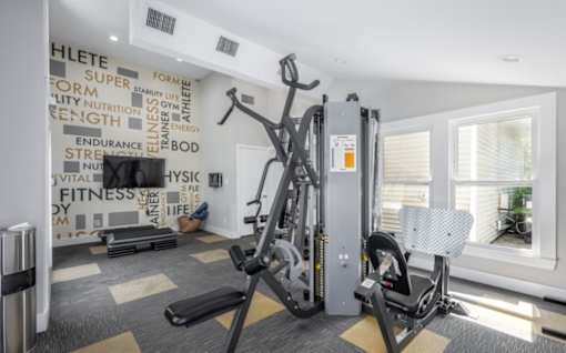 A gym with a wall of fitness related words at Madison at Eden Brook, 21046