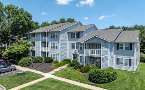 Apartment complex with multiple buildings and green lawns at Madison at Eden Brook, 21046