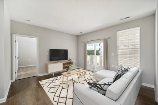 Living Room With TV at MetroPlace at Town Center, Camp Springs