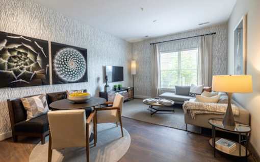A modern living room with a dining table and chairs at Mira Upper Rock, Maryland, 20850